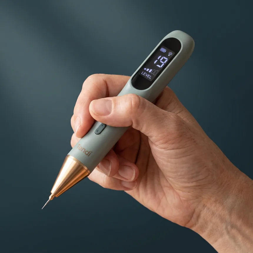 The Tendi Pen held in an adult hand